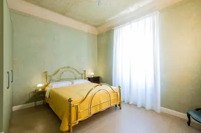 Letto o letti in una camera di Pendici di Fiesole - Appartamento Copperstone