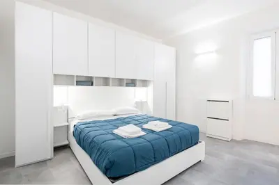 Letto o letti in una camera di GuestHost - Viuzzo 7 - Florence White Apartment