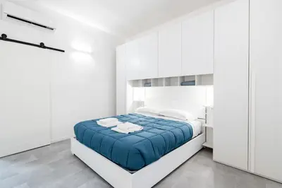 Letto o letti in una camera di GuestHost - Viuzzo 7 - Florence White Apartment