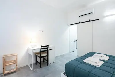 Letto o letti in una camera di GuestHost - Viuzzo 7 - Florence White Apartment