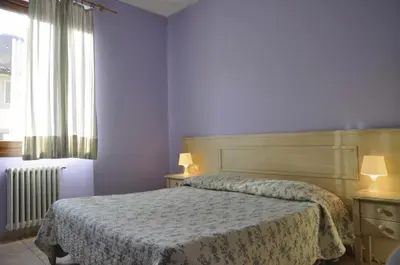 Letto o letti in una camera di Hotel Regina