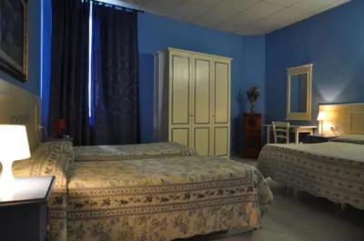 Letto o letti in una camera di Hotel Regina