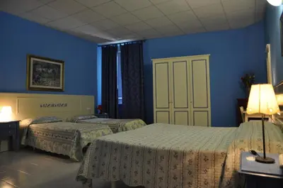Letto o letti in una camera di Hotel Regina
