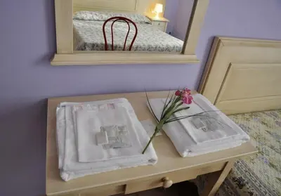 Letto o letti in una camera di Hotel Regina