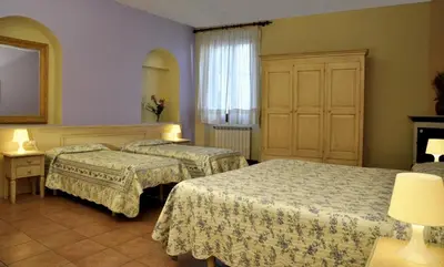 Letto o letti in una camera di Hotel Regina