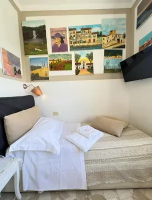 Letto o letti in una camera di Souvenir Maya