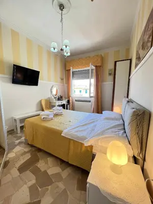 Letto o letti in una camera di Souvenir Maya