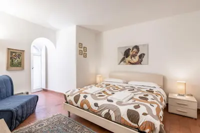 Letto o letti in una camera di GuestHost - Torre dei Giudi apartments