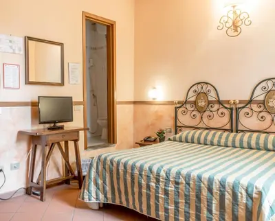 Letto o letti in una camera di Hotel Monica