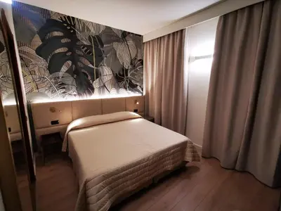 Letto o letti in una camera di Hotel Balcony