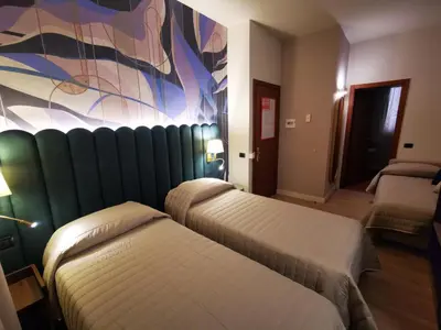 Letto o letti in una camera di Hotel Balcony