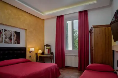 Letto o letti in una camera di Hotel Kursaal & Ausonia