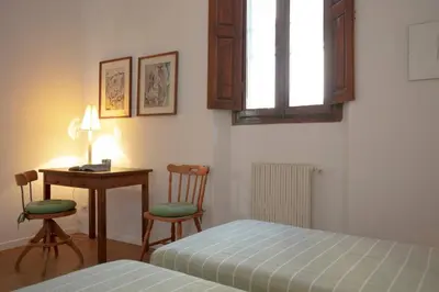Letto o letti in una camera di Roommo Viuzzo delle Canne