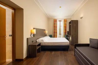 Letto o letti in una camera di Hotel Villa Betania