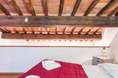 Letto o letti in una camera di Lovely Loft 2 steps from the Cathedral in Florence