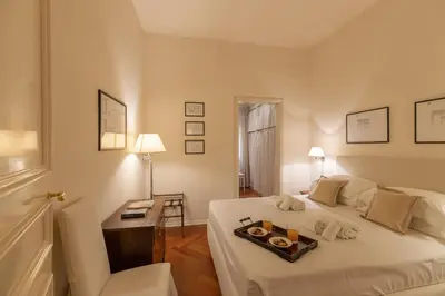 Letto o letti in una camera di Big apartment a stone's throw from the Duomo
