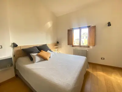 Letto o letti in una camera di Giglio Apartment by Mamo Florence