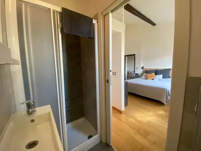 Letto o letti in una camera di Giglio Apartment by Mamo Florence