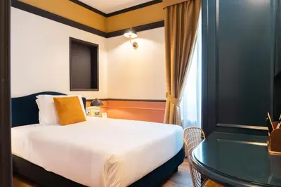 Letto o letti in una camera di JOIVY Together Florence Secret Nest