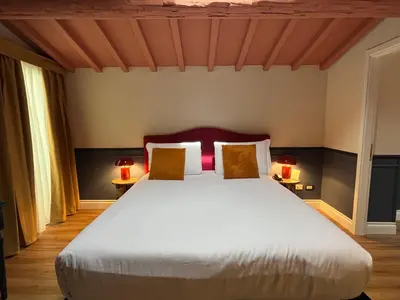 Letto o letti in una camera di JOIVY Together Florence Secret Nest