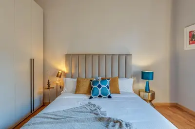 Letto o letti in una camera di Apartments Florence - Santo Stefano's Mirror
