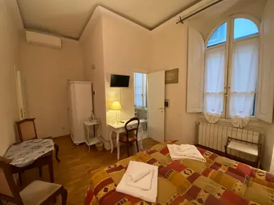 Letto o letti in una camera di Relais Del Duomo