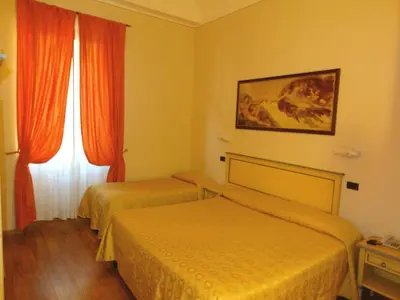 Letto o letti in una camera di Hotel Vasari