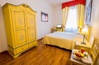Letto o letti in una camera di Hotel Vasari