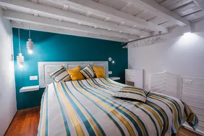 Letto o letti in una camera di Sant'Ambrogio - Appartamento City Turquoise
