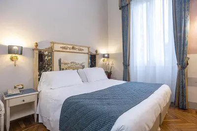 Letto o letti in una camera di Hotel Donatello