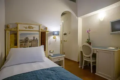 Letto o letti in una camera di Hotel Donatello