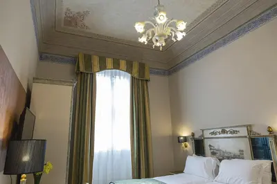 Letto o letti in una camera di Hotel Donatello