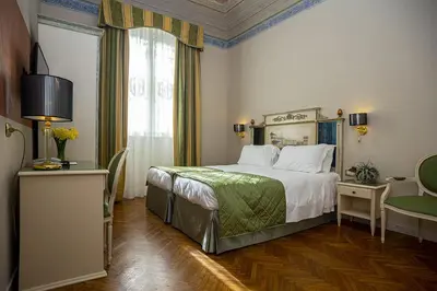 Letto o letti in una camera di Hotel Donatello
