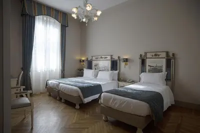 Letto o letti in una camera di Hotel Donatello