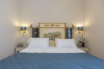 Letto o letti in una camera di Hotel Donatello