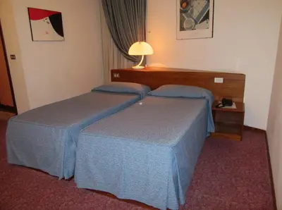 Letto o letti in una camera di Hotel Giardino