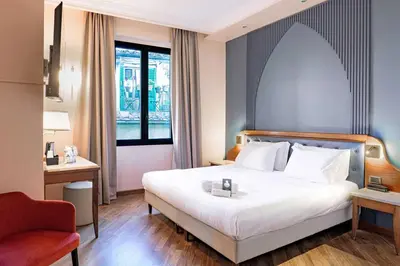 Letto o letti in una camera di B&B Hotel Firenze Laurus Al Duomo