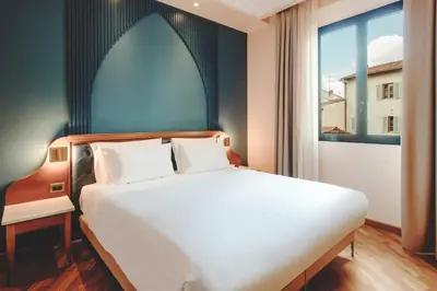 Letto o letti in una camera di B&B Hotel Firenze Laurus Al Duomo