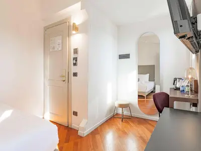 Letto o letti in una camera di B&B Hotel Firenze Laurus Al Duomo