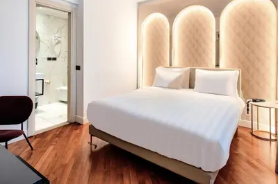 Letto o letti in una camera di B&B Hotel Firenze Laurus Al Duomo