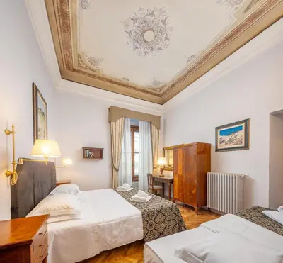 Letto o letti in una camera di Il Marzocco Boutique B&B