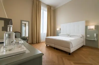 Letto o letti in una camera di Hotel Ariele