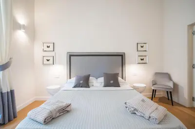 Letto o letti in una camera di Brunelleschi Suite