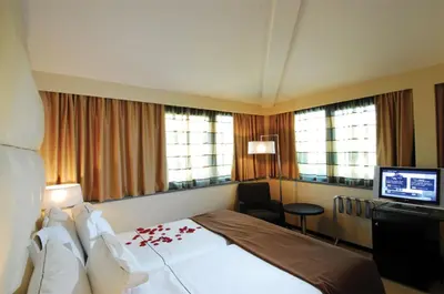 Letto o letti in una camera di Cosmopolitan Hotel