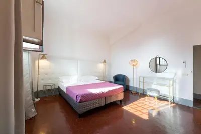 Letto o letti in una camera di Borgo Santa Croce
