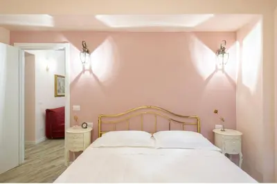 Letto o letti in una camera di Residenza dei Piaceri Perduti-Rosa