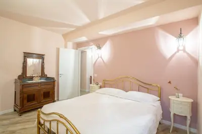 Letto o letti in una camera di Residenza dei Piaceri Perduti-Rosa