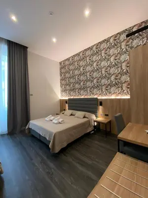 Letto o letti in una camera di Hotel Delle Camelie