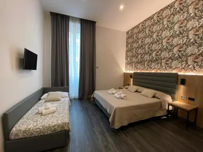 Letto o letti in una camera di Hotel Delle Camelie