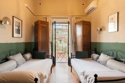 Letto o letti in una camera di Firenze Rentals Corso 12
